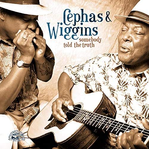 CD cover featuring two musicians with a guitar, titled “Somebody Told The Truth.”
