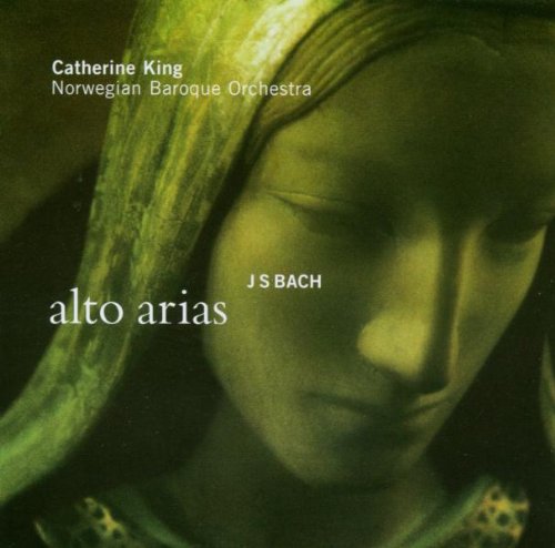 CD cover featuring a close-up of a woman’s face in green tones.