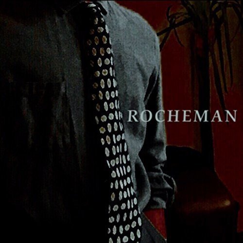 Rocheman album cover featuring a person in a suit and tie.