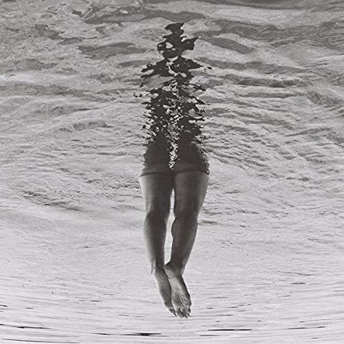 Black and white CD cover featuring a submerged figure in water.