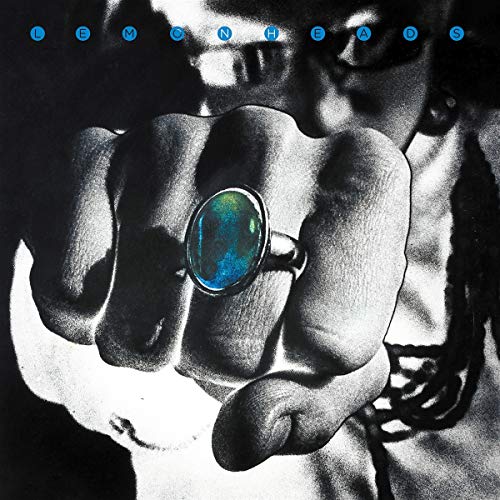 Black and white album cover featuring a hand holding a ring.