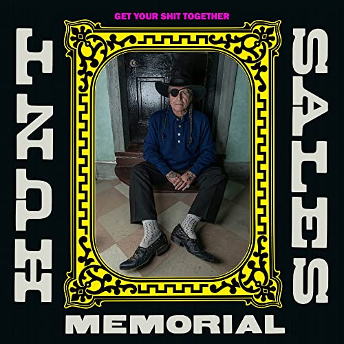 Album cover featuring a man in a hat seated in an ornate frame.