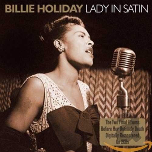 Billie Holiday singing into a vintage microphone on album cover.