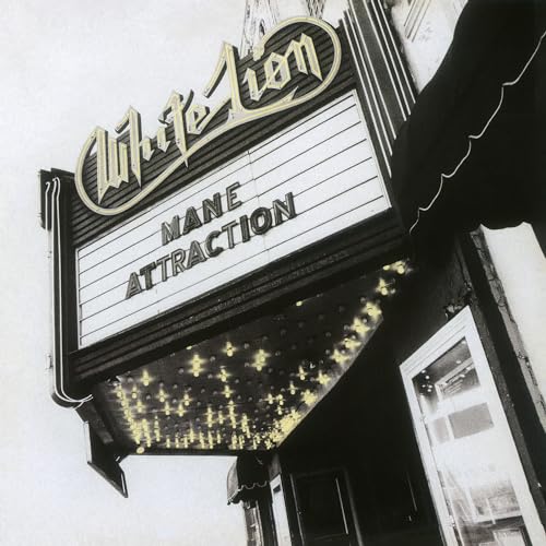 A black and white photo of a theater marquee reading White Lion Mane Attraction.