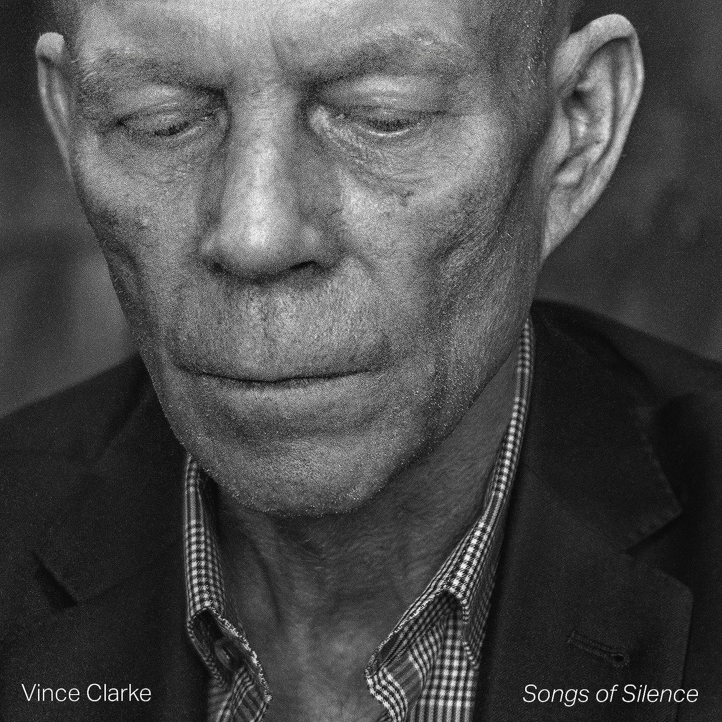 Black and white portrait of Vince Clarke, album cover for "Songs of Silence.