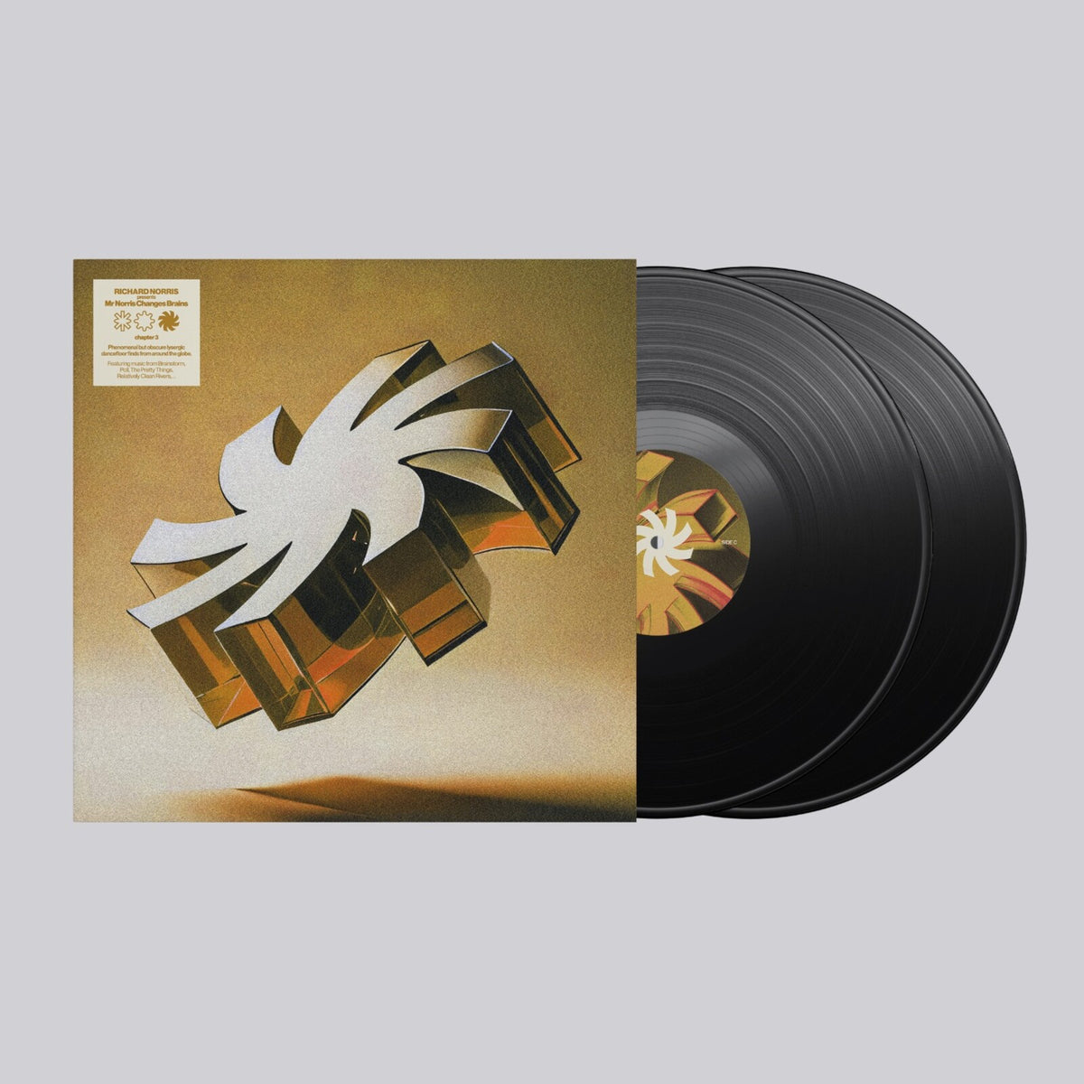 Vinyl record with abstract geometric cover art in gold and black.