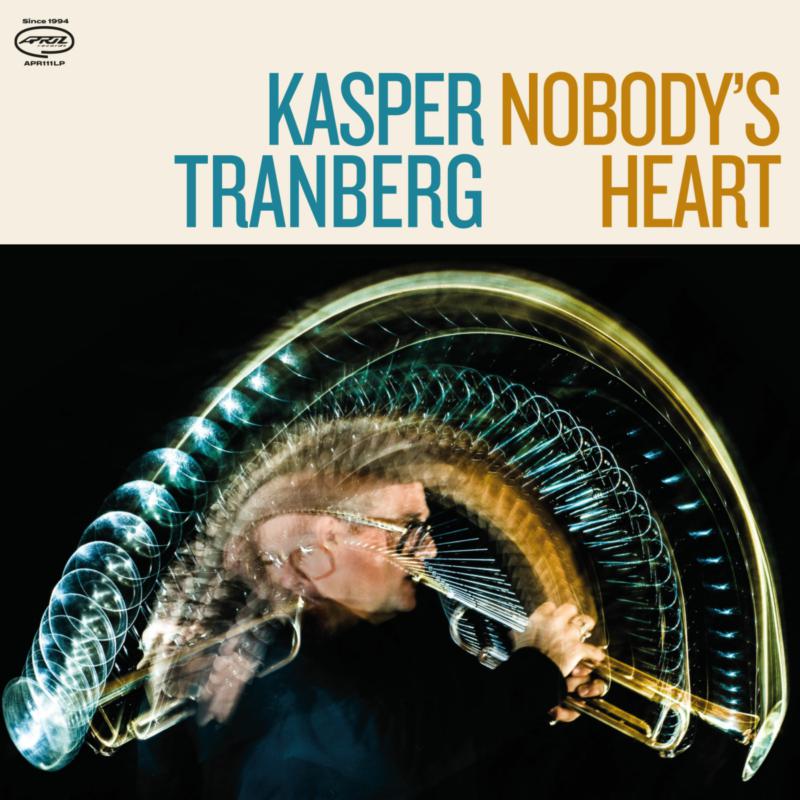 Vinyl record cover: abstract portrait with glowing lines and a face.