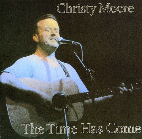 Christy Moore album cover: singer with guitar, dark background.