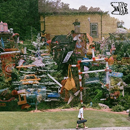 Album cover: cluttered yard art with a house and walking figure.