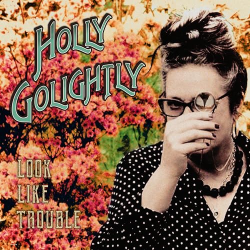 Holly Golightly album cover: woman with glasses looking through binoculars.