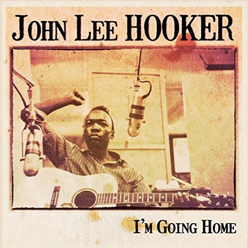 John Lee Hooker album cover featuring a musician with a guitar and microphones.