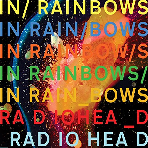 Album cover with colorful text overlaying a dark, abstract, splattered paint background.