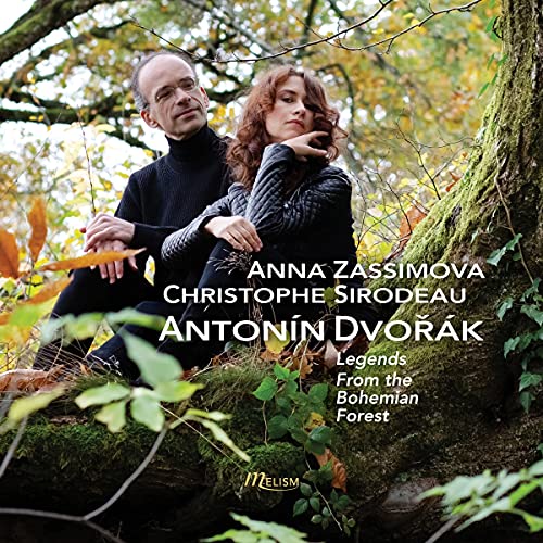 CD cover featuring two people seated by a tree in a forest.