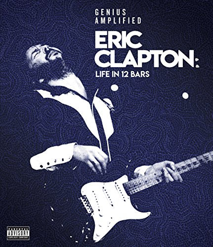 Eric Clapton playing a guitar, DVD cover with patterned blue background.
