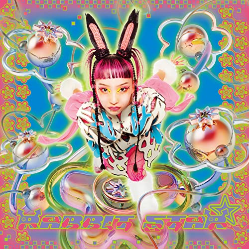 Woman with pink hair and rabbit ears amidst colorful, surreal imagery.