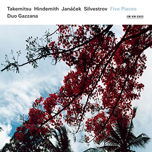 CD cover with red flowers against a blue, cloudy sky.