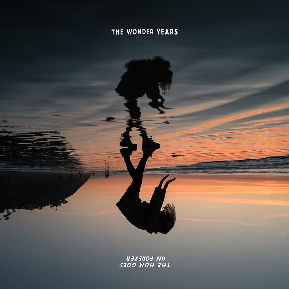 CD cover: Silhouette of a person falling into water, reflected.