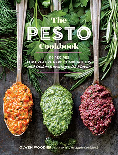 Cookbook cover featuring three spoonfuls of colorful pesto surrounded by herbs.