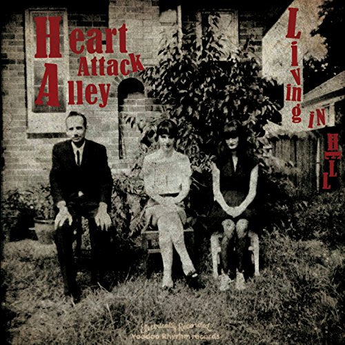 Black and white CD cover with a band posing in front of a building.