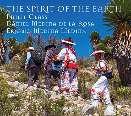 CD cover: people walking through a desert landscape with palm trees.