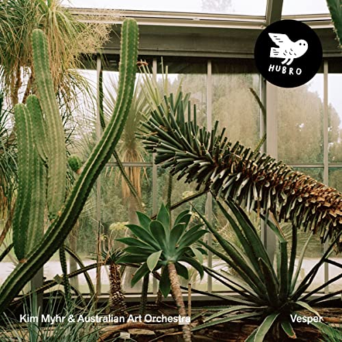 CD cover featuring cacti and other plants inside a greenhouse.