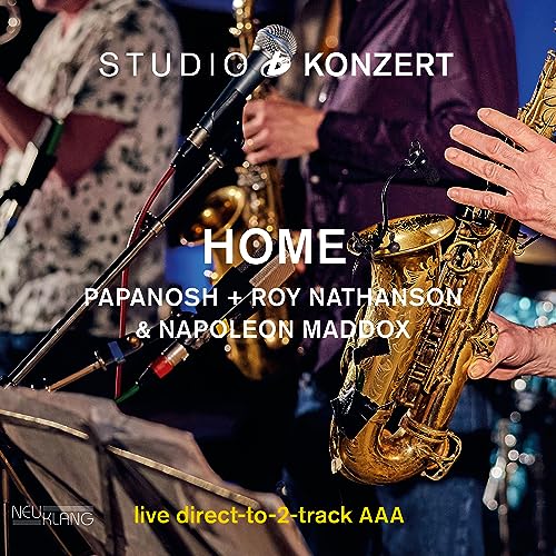 Vinyl album cover featuring musicians playing saxophones in a studio setting.