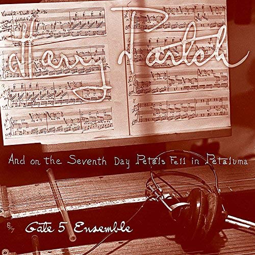 Sepia-toned vinyl record cover with sheet music, headphones, and instruments.