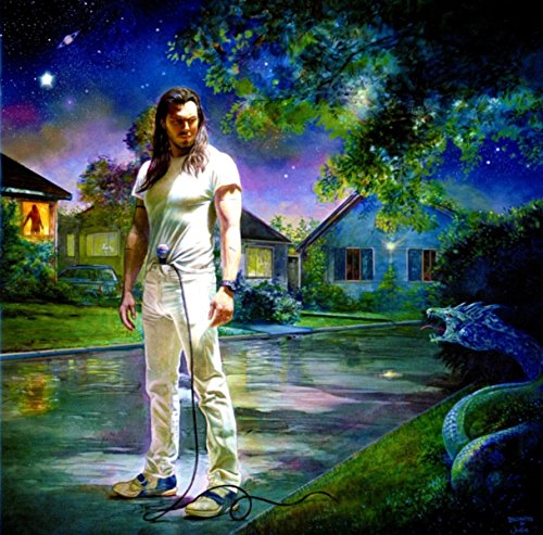 Long-haired man in white clothing stands in a suburban street beneath a starry sky.