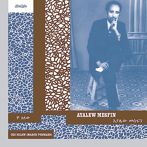 Vinyl album cover featuring Ayalew Mesfin in a suit, patterned background.