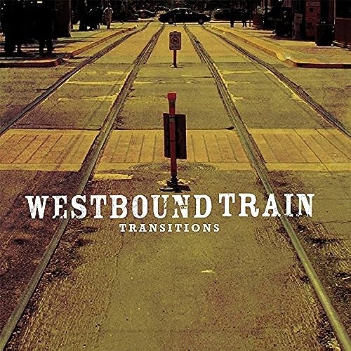Vinyl record cover: train tracks receding into a distant street.