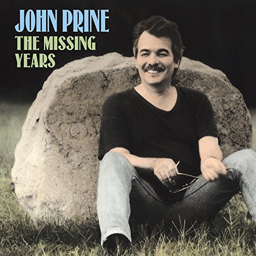 John Prine album cover: portrait of the artist seated by a stone.
