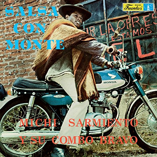 Vintage vinyl album cover featuring a man with a motorcycle.