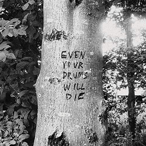 Black and white photo of text carved into a tree trunk.