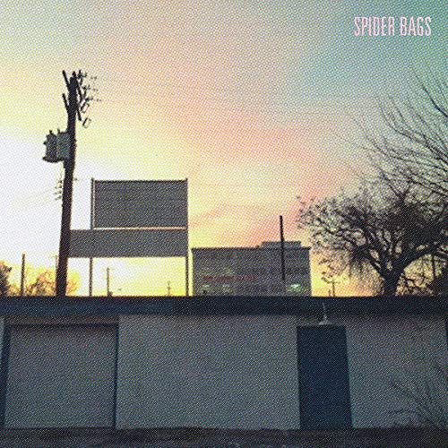 CD cover with a sunset over a building and utility pole.