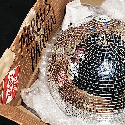 Disco ball nestled in bubble wrap within a cardboard box labeled "Marcus Paquin".