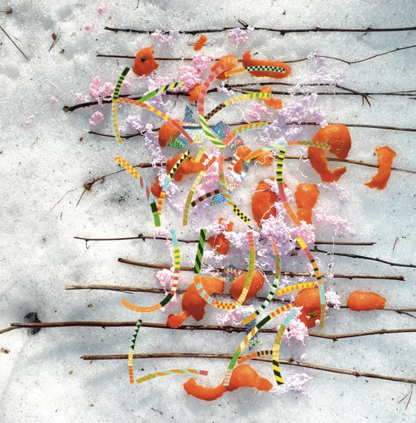 Album cover with oranges, branches, and colorful paper scraps on snow.