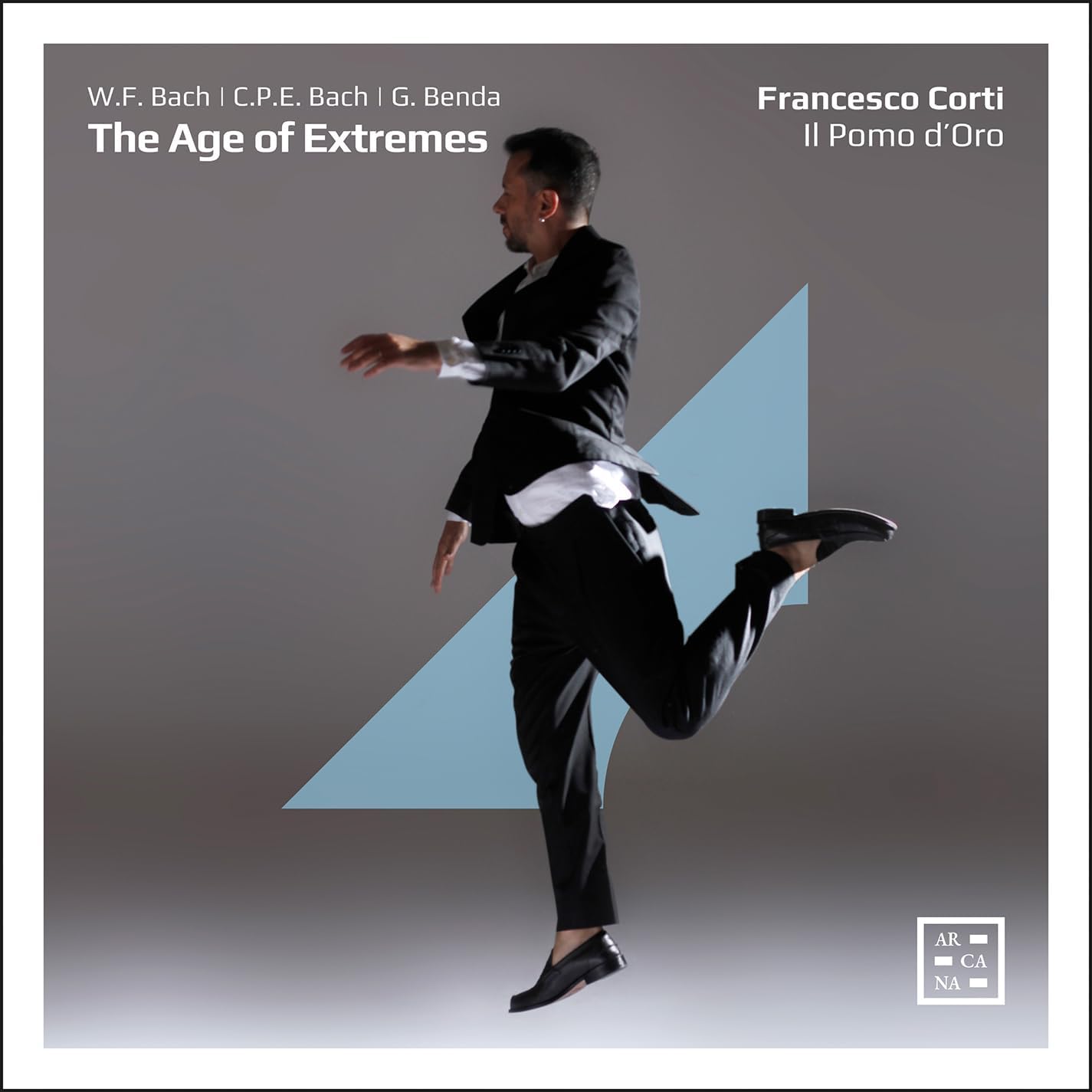 CD cover featuring a man in a suit mid-leap against a grey background.