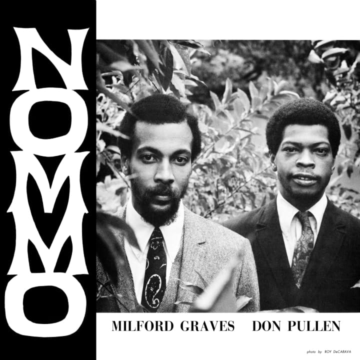 Black and white album cover featuring three men in a garden.