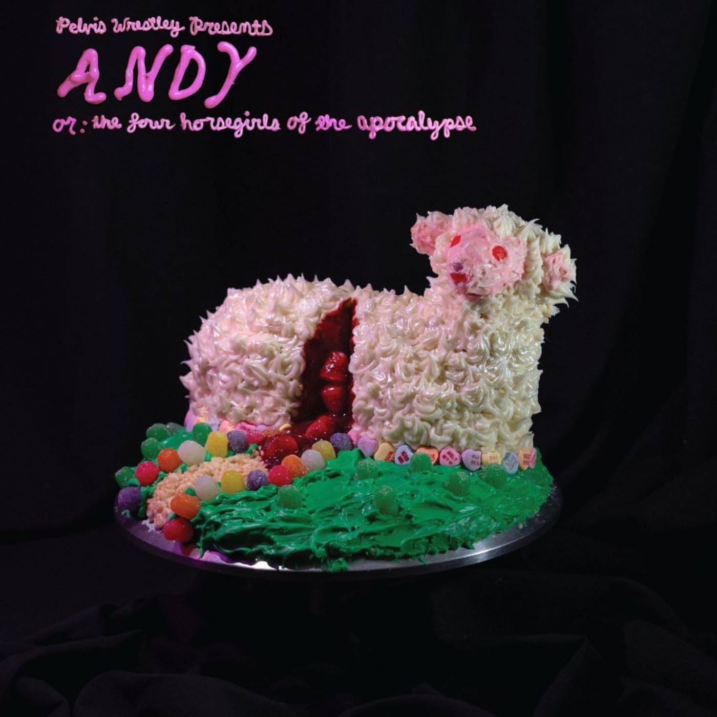 Album cover featuring a pink frosting lamb sculpture on a silver platter.
