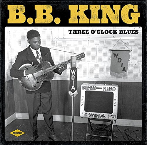 B.B. King album cover, black and white photo of him with guitar.