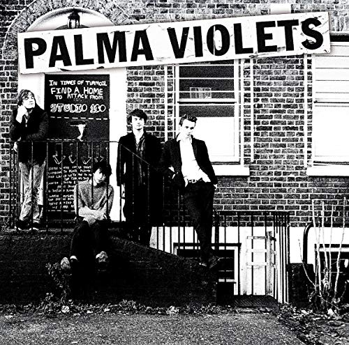 Palma Violets album cover: band members in front of a brick building.