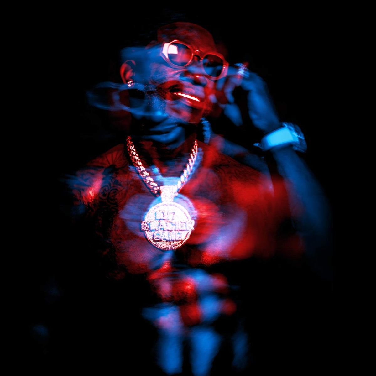 Gucci Mane portrait with red and blue lighting, jewelry, and smoke.