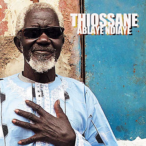 Portrait of Ablaye Ndiaye Thiossane, a Senegalese musician, wearing sunglasses.