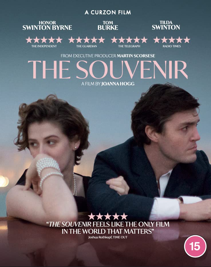 Movie poster for "The Souvenir" featuring two actors in a vintage setting.