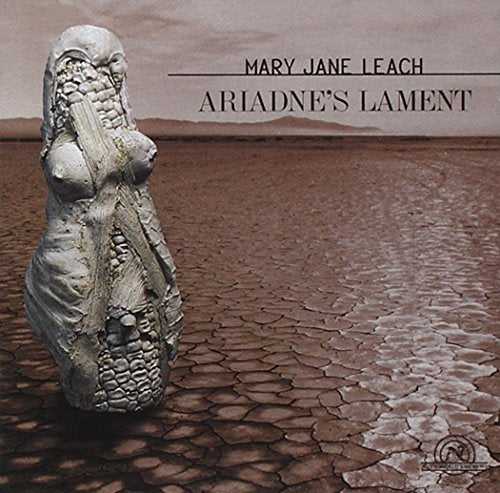 CD cover: sculpted figure in a cracked, dry landscape.