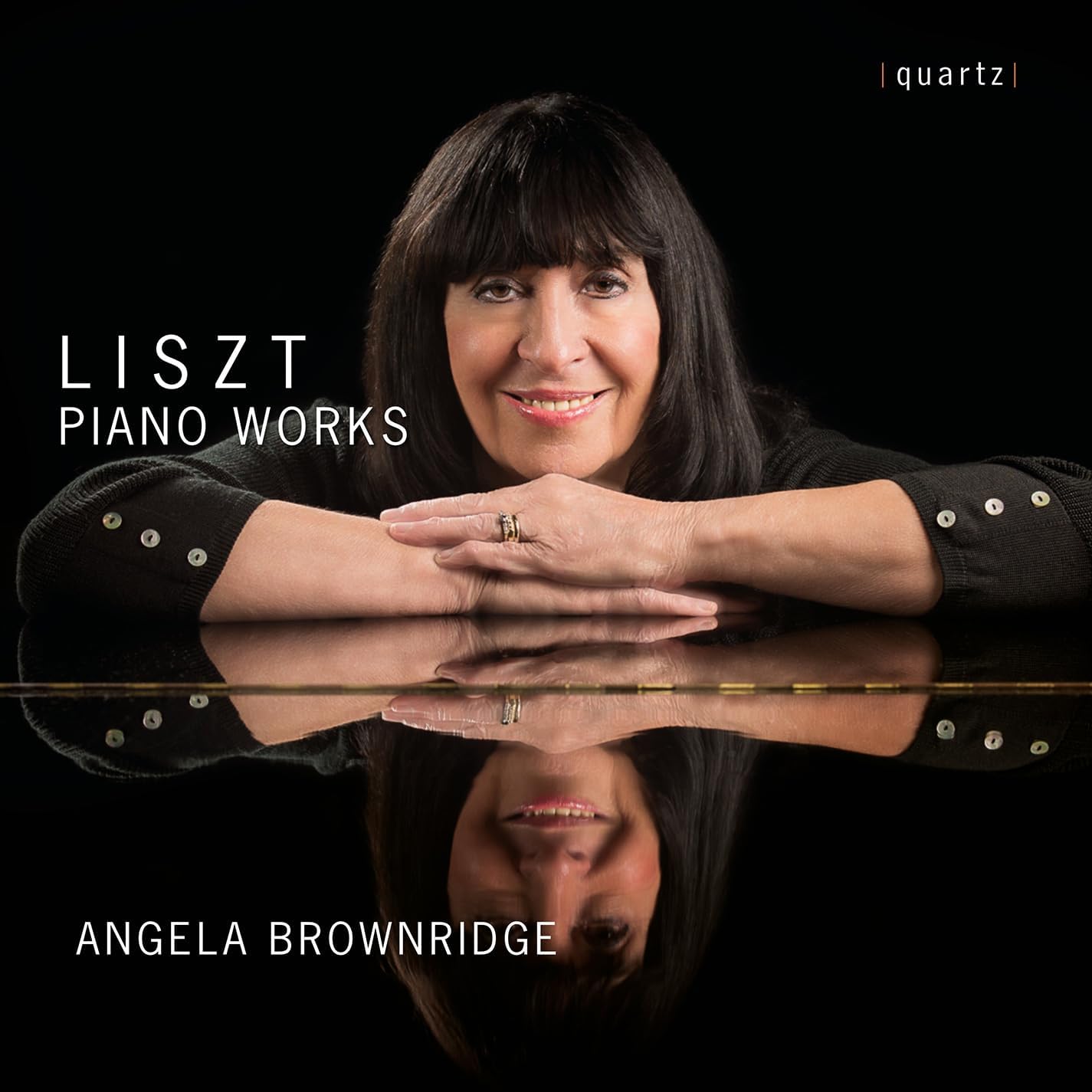 CD cover featuring pianist Angela Brownridge reflected in a piano’s polished surface.