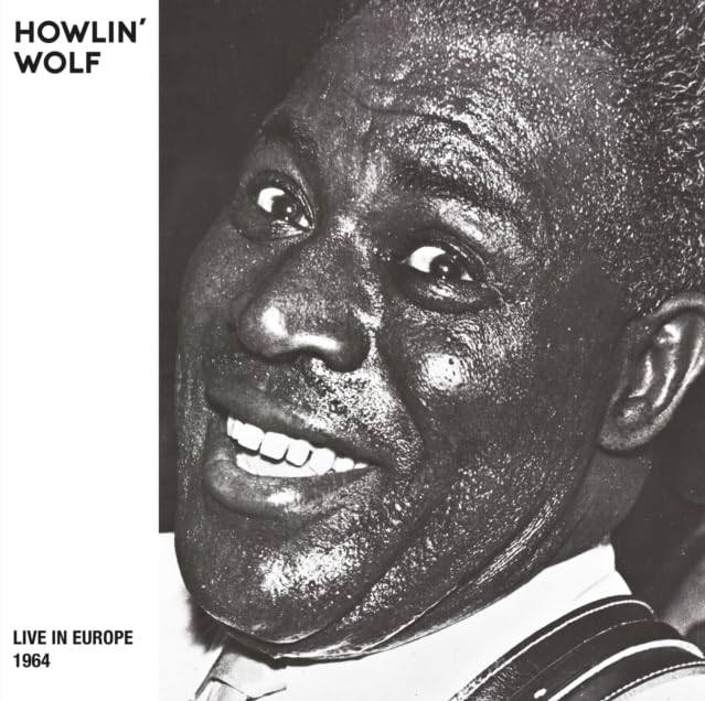 Black and white portrait of Howlin' Wolf, smiling, with album title.