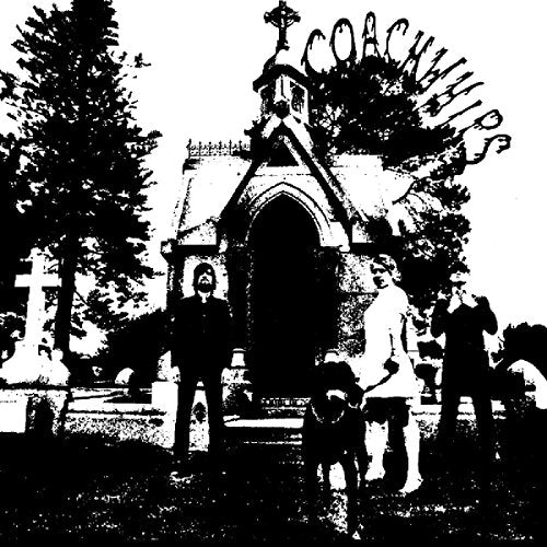 Black and white image of a band in front of a building.