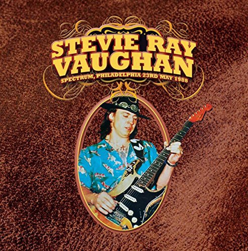 Stevie Ray Vaughan portrait with red guitar, album cover for Spectrum.