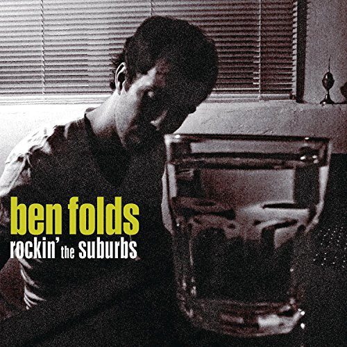 Album cover for Ben Folds Five’s “Rockin’ The Suburbs” featuring a man and glass.